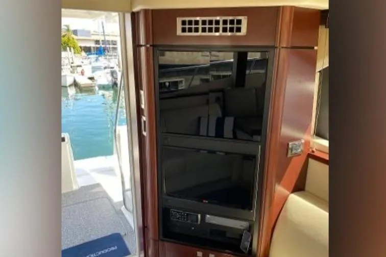Slide: The Image of Interior of 2007 Sea Ray 36 Sedan Bridge yacht with modern entertainment system. - 33