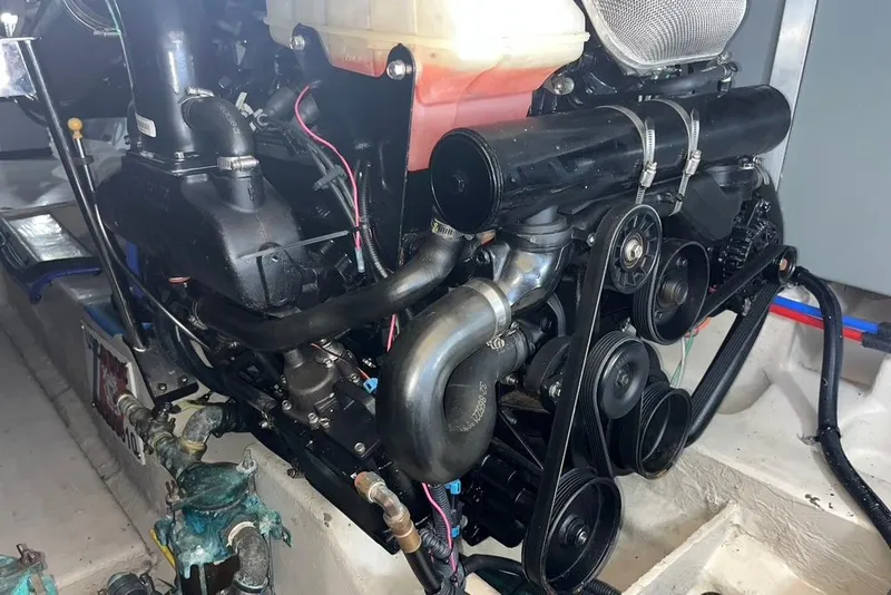 Slide: The Image of Engine compartment of a 2007 Sea Ray 36 Sedan Bridge boat, showcasing mechanical components. - 36