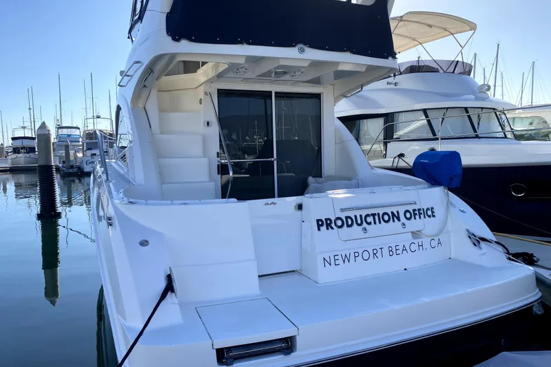 Slide: The Image of 2007 Sea Ray 36 Sedan Bridge yacht cruising near scenic coastline. - 5