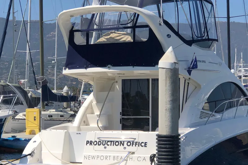 Slide: The Image of 2007 Sea Ray 36 Sedan Bridge docked, labeled "Production Office," Newport Beach, CA. - 6