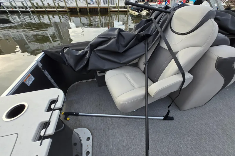 Slide: The Image of 2022 Sylvan L3 Party Fish boat interior with seats and fishing equipment. - 17