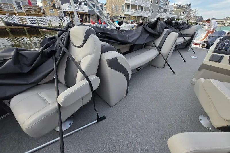 Slide: The Image of 2022 Sylvan L3 Party Fish boat interior with covered seating and modern design. - 18