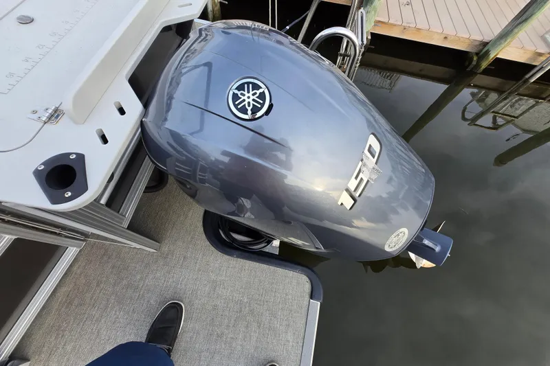 Slide: The Image of 2022 Sylvan L3 Party Fish with Yamaha 150 outboard motor at dock. - 19
