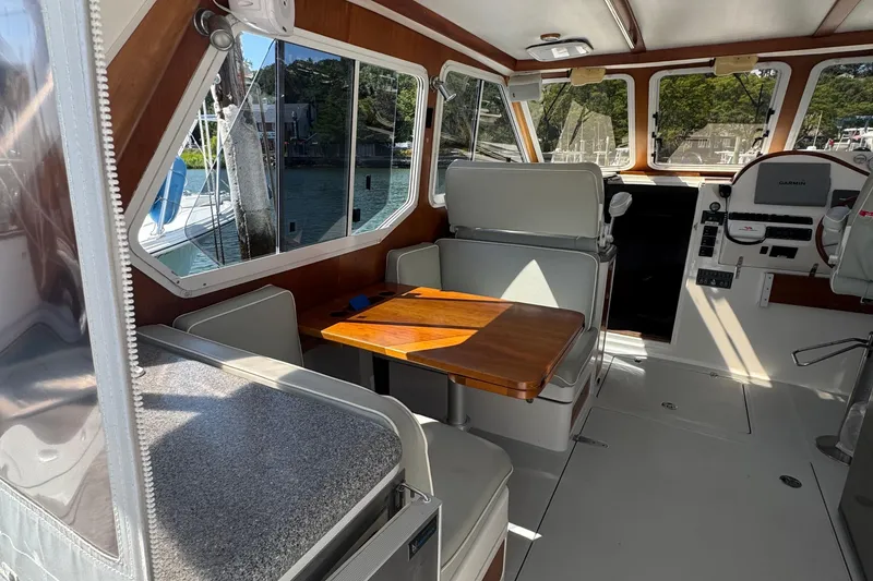 Slide: The Image of Interior of 2004 True North 38 Heritage boat with seating and navigation equipment. - 13