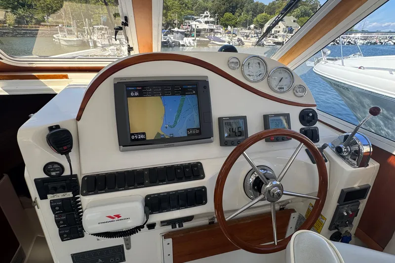 Slide: The Image of Cockpit of 2004 True North 38 Heritage boat with navigation equipment and steering wheel. - 16