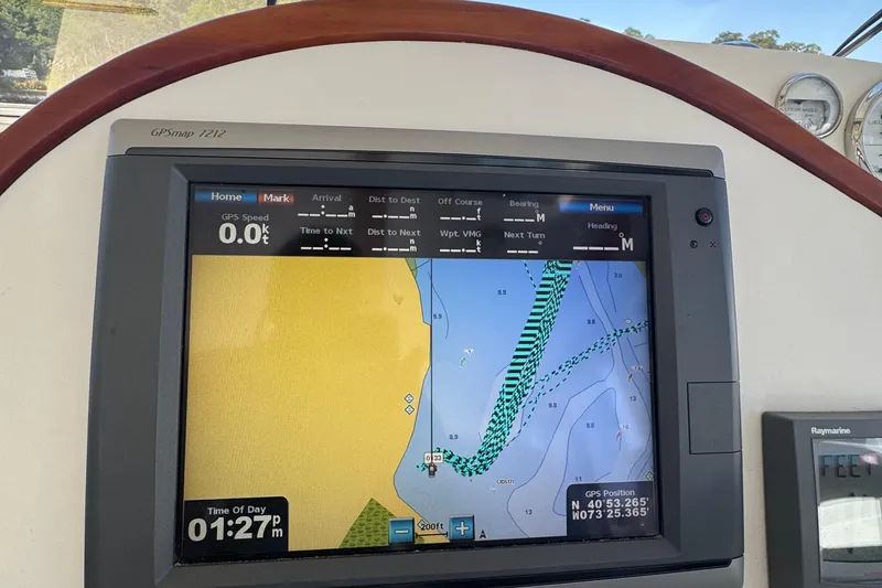 Slide: The Image of GPS navigation screen on a 2004 True North 38 Heritage boat, showing map and coordinates. - 17