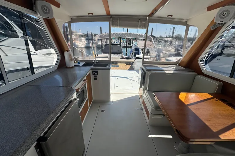 Slide: The Image of Interior of 2004 True North 38 Heritage yacht with kitchen and seating area. - 23