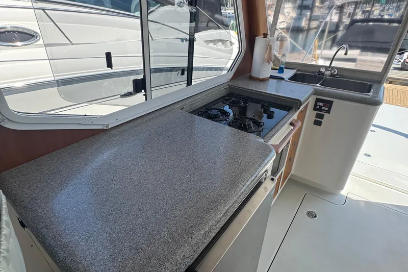 Slide: The Image of Galley kitchen in 2004 True North 38 Heritage yacht with stove and sink. - 24