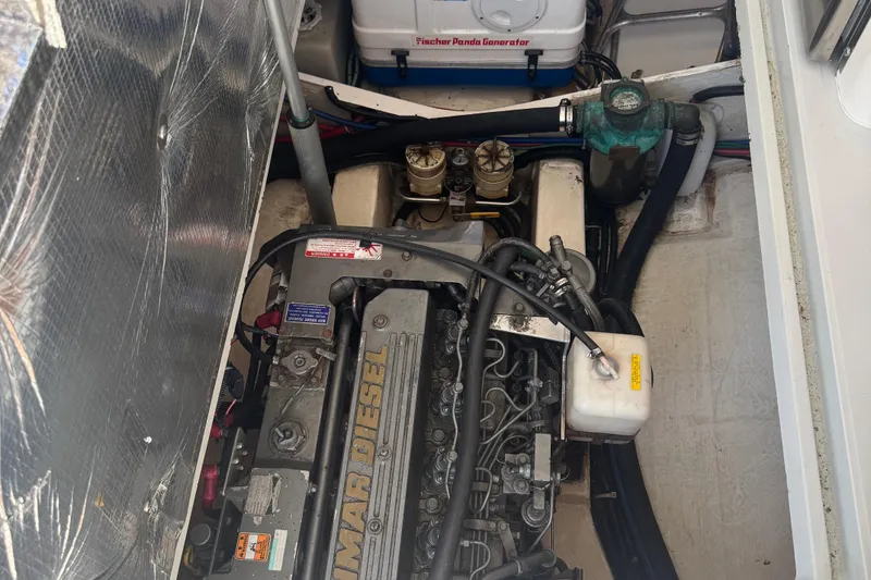 Slide: The Image of Engine compartment of 2004 True North 38 Heritage with Yanmar diesel engine and Fischer Panda generator. - 30