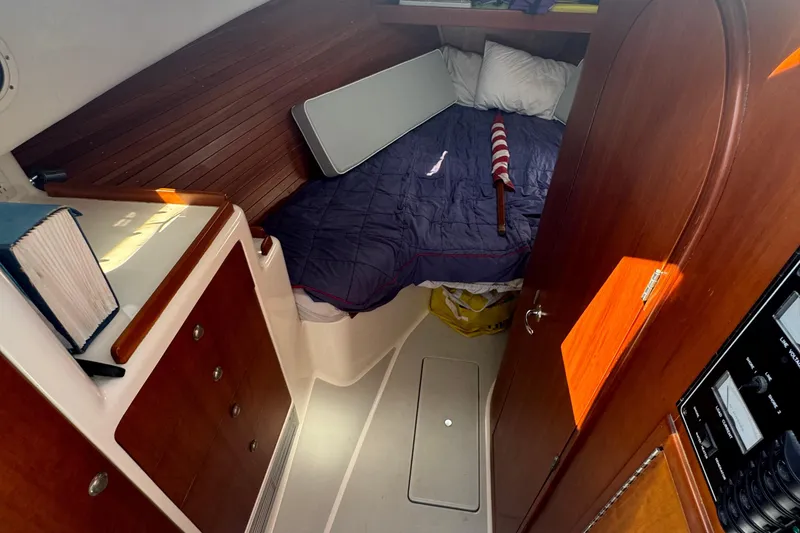 Slide: The Image of Cozy cabin interior of 2004 True North 38 Heritage boat with wooden finishes. - 33