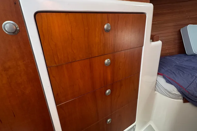 Slide: The Image of Wooden drawers in a 2004 True North 38 Heritage boat interior cabin. - 36