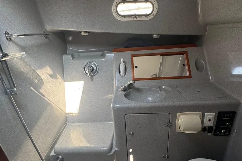 Slide: The Image of 2004 True North 38 Heritage yacht bathroom with sink, shower, and mirror. - 38