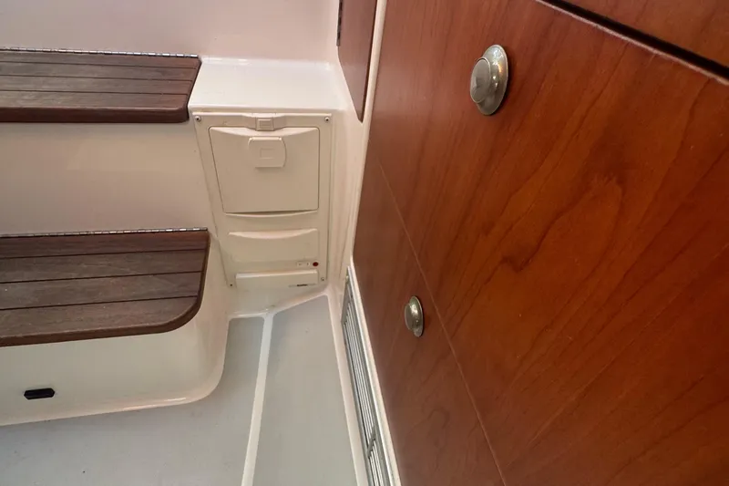 Slide: The Image of Interior of 2004 True North 38 Heritage boat with wooden steps and cabinetry. - 42