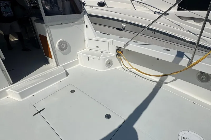 Slide: The Image of Spacious deck of 2004 True North 38 Heritage boat with clean white finish. - 6