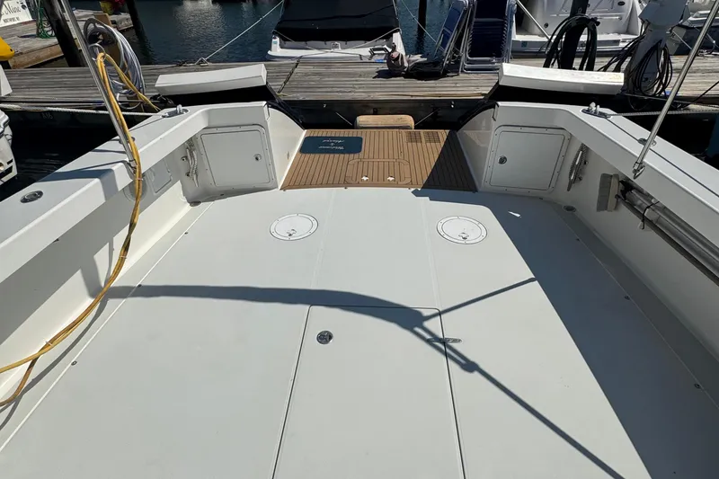 Slide: The Image of Spacious deck of 2004 True North 38 Heritage boat at marina. - 9