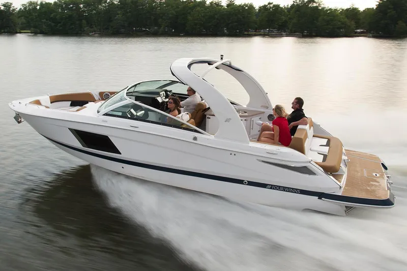 The Image of Manufacturer Provided Image: 2023 Four Winns Horizon H290 speedboat cruising on a lake with passengers. - 0