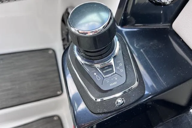 Slide: The Image of 2023 Four Winns H290 boat joystick control system, close-up view. - 33