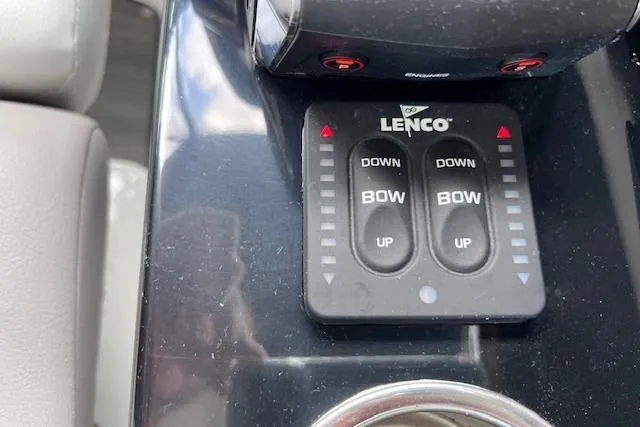 Slide: The Image of Control panel of a 2023 Four Winns H290 boat with Lenco trim tabs. - 38