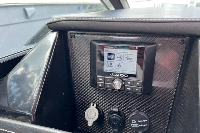 Slide: The Image of Dashboard of 2023 Four Winns H290 boat featuring JL Audio system. - 39
