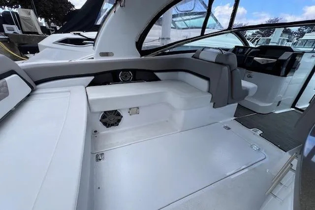 Slide: The Image of 2023 Four Winns H290 boat interior with sleek seating and modern design. - 41