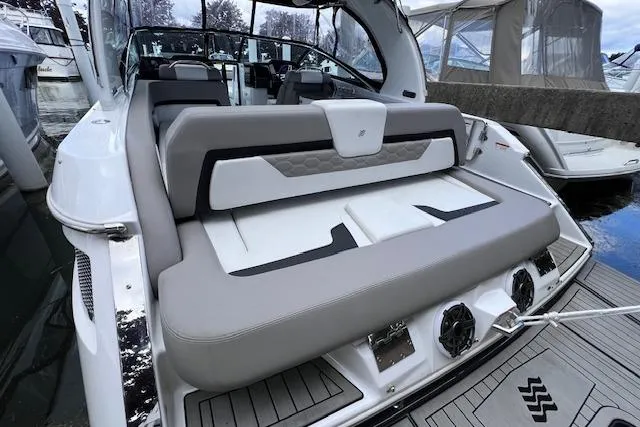 Slide: The Image of 2023 Four Winns H290 boat with luxurious seating and modern design. - 47