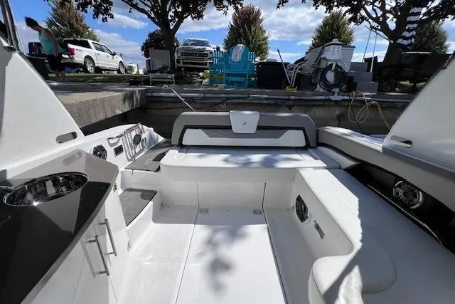 Slide: The Image of 2023 Four Winns H290 boat interior with seating and storage compartments. - 50
