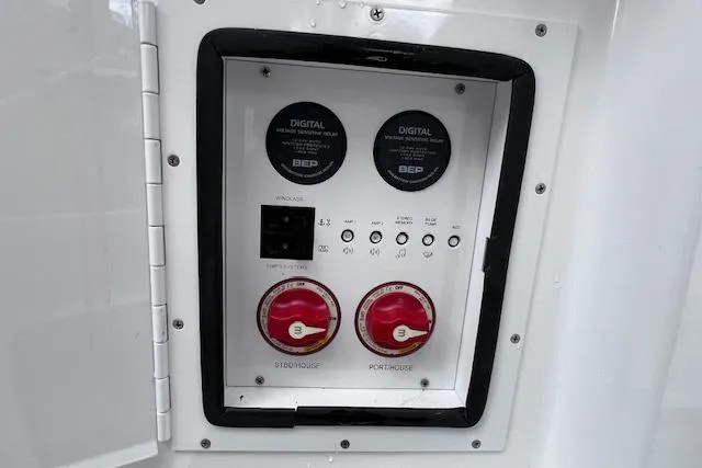 Slide: The Image of Control panel of 2023 Four Winns H290 boat with digital displays and switches. - 52
