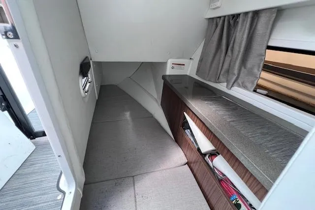 Slide: The Image of Interior cabin of 2023 Four Winns H290 boat with modern design and storage. - 54