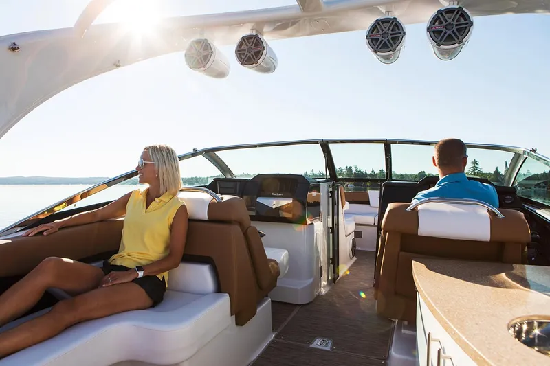 Slide: The Image of Manufacturer Provided Image: 2023 Four Winns Horizon H290 boat interior with passengers enjoying a sunny day. - 6