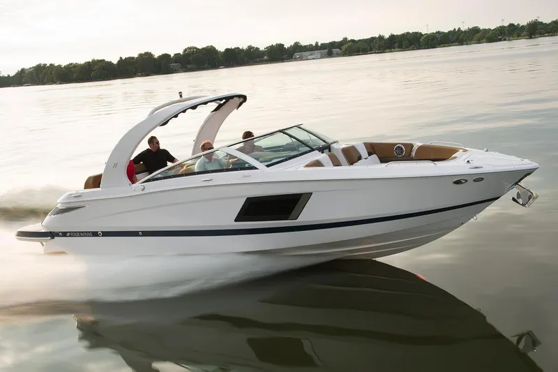 Slide: The Image of Manufacturer Provided Image: 2023 Four Winns Horizon H290 speedboat cruising on a calm lake. - 64