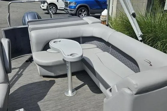Slide: The Image of 2020 Bennington SXP 21 SLXP pontoon boat interior with gray seating and table. - 14