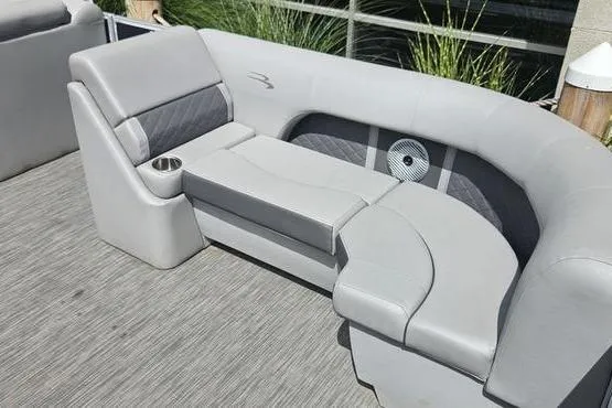 Slide: The Image of 2020 Bennington SXP 21 SLXP boat seating with gray upholstery and cup holder. - 3