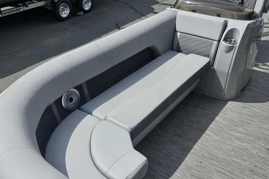 Slide: The Image of 2020 Bennington SXP 21 SLXP boat interior with gray seating and speaker. - 4