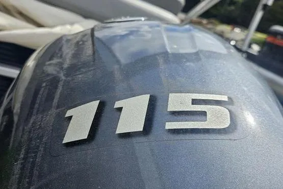 Slide: The Image of Close-up of a 2020 Bennington SXP 21 SLXP boat engine with "115" marking. - 6