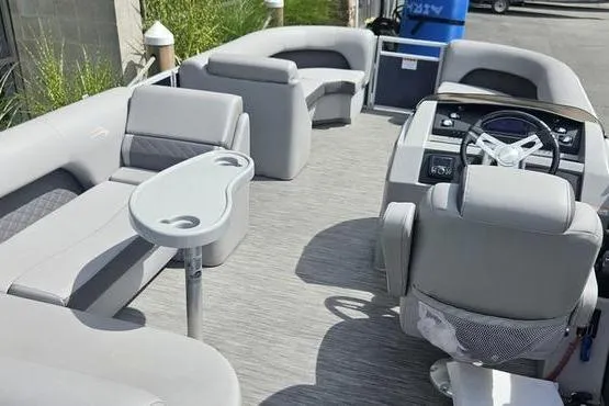 Slide: The Image of 2020 Bennington SXP 21 SLXP pontoon boat interior with gray seating and steering console. - 7