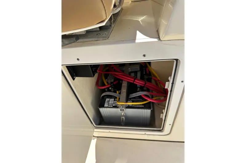 Slide: The Image of 2017 Scout 350 LXF boat battery compartment with wiring. - 13