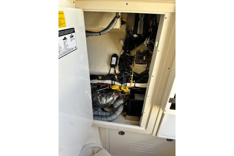 Slide: The Image of 2017 Scout 350 LXF boat interior wiring and components, showcasing detailed electrical setup. - 18