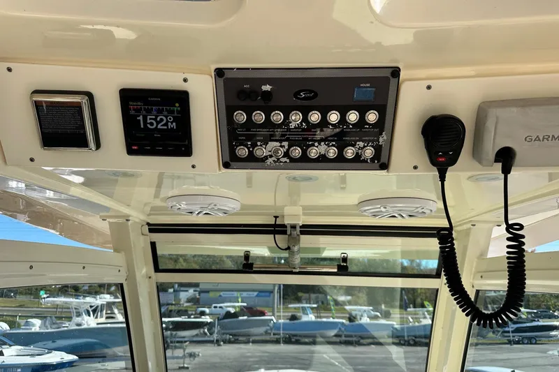 Slide: The Image of 2017 Scout 350 LXF boat dashboard with Garmin display and control panel. - 21