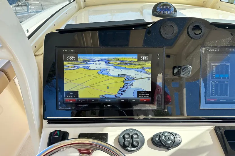 Slide: The Image of 2017 Scout 350 LXF boat dashboard with Garmin GPS navigation display. - 22