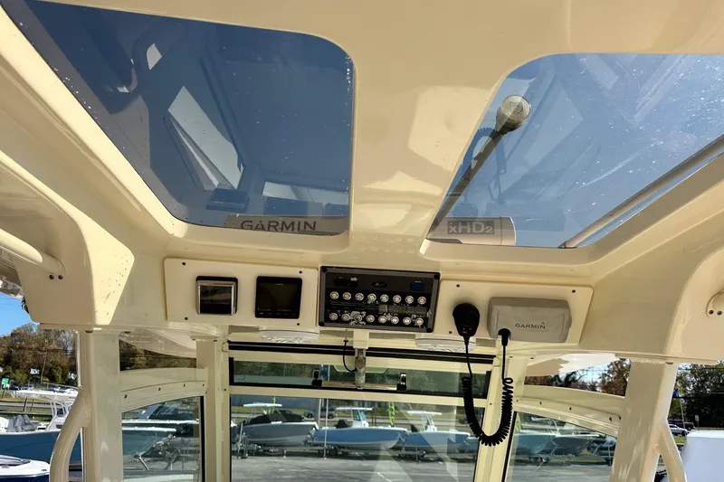 Slide: The Image of 2017 Scout 350 LXF boat interior with Garmin electronics and sunroof. - 28