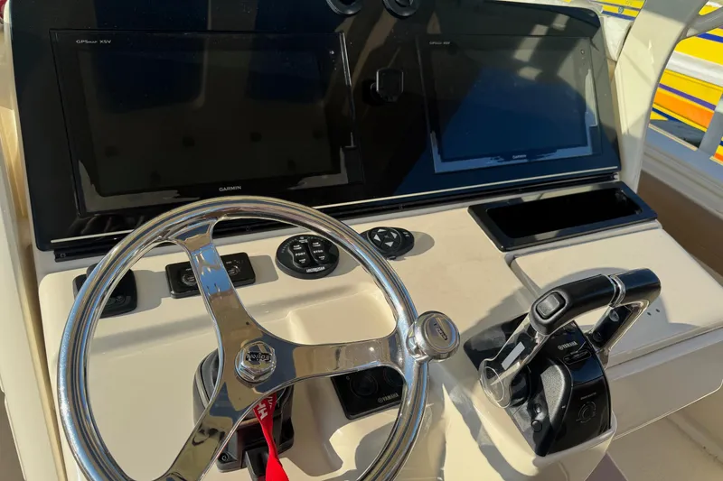 Slide: The Image of 2017 Scout 350 LXF boat with triple Yamaha 300 engines on trailer. - 3