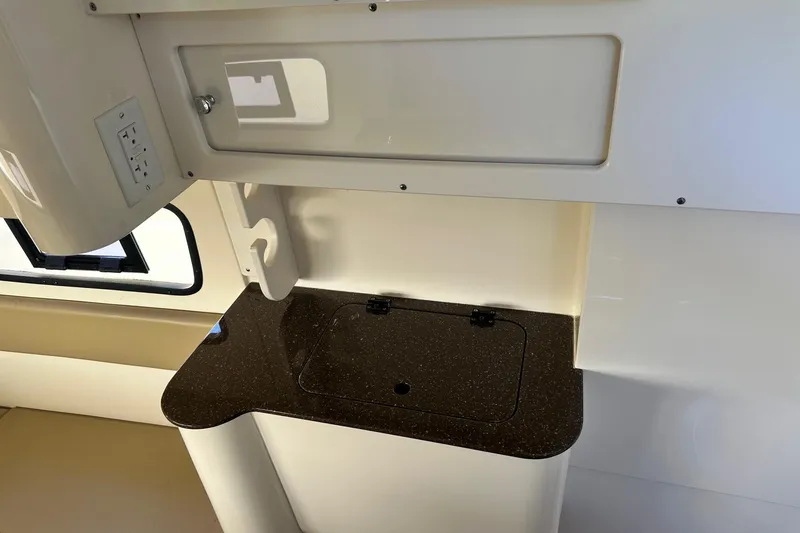 Slide: The Image of 2017 Scout 350 LXF interior with countertop and storage compartment. - 33