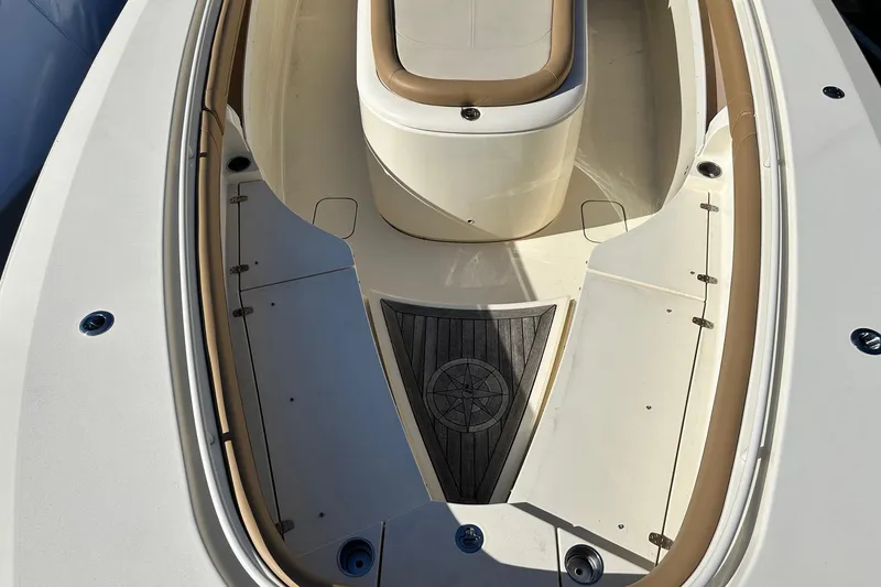 Slide: The Image of 2017 Scout 350 LXF boat interior with tan seating and wood accents. - 35