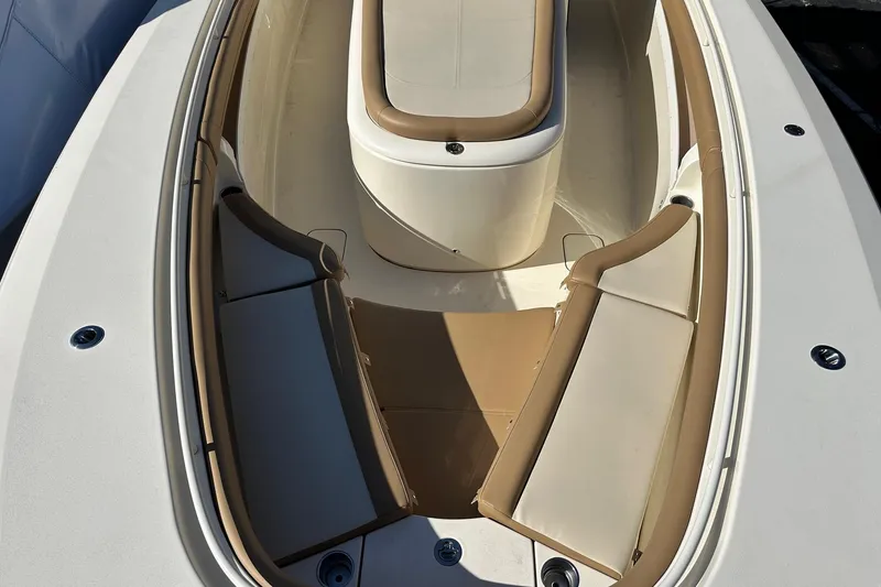 Slide: The Image of 2017 Scout 350 LXF boat interior with tan and white seating arrangement. - 39