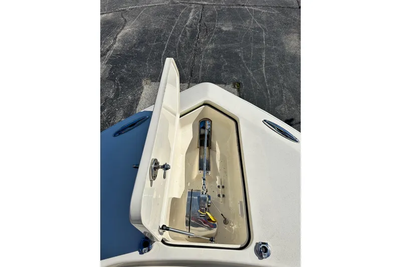 Slide: The Image of 2017 Scout 350 LXF boat anchor compartment open on deck. - 42