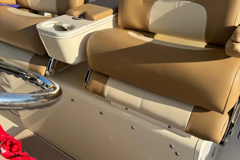 Slide: The Image of 2017 Scout 355 LXF boat with triple outboard engines, docked on calm water. - 5