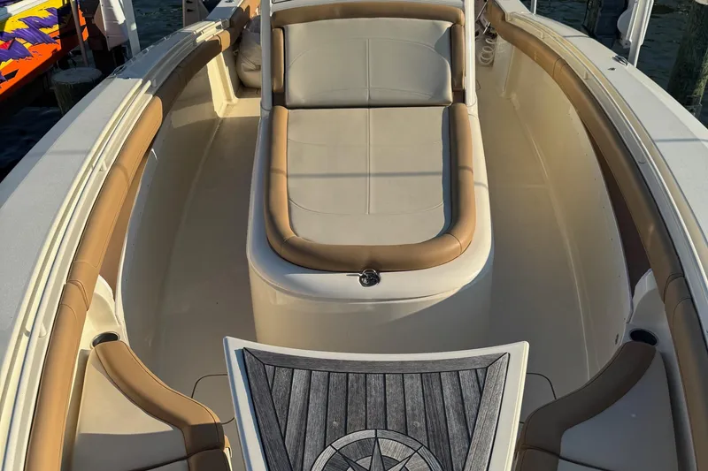 Slide: The Image of 2017 Scout 350 LXF boat emblem on a cream-colored surface. - 8