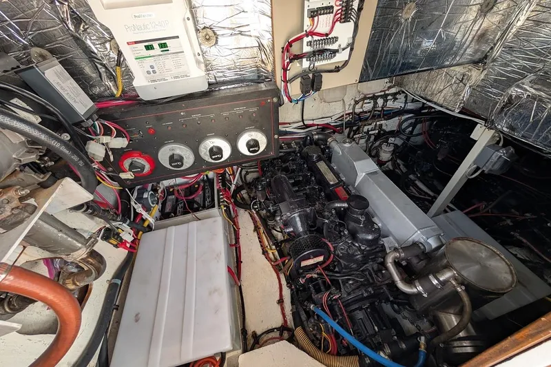 Slide: The Image of Engine room of 1989 Bayliner 3888 Motoryacht with control panel and wiring. - 24