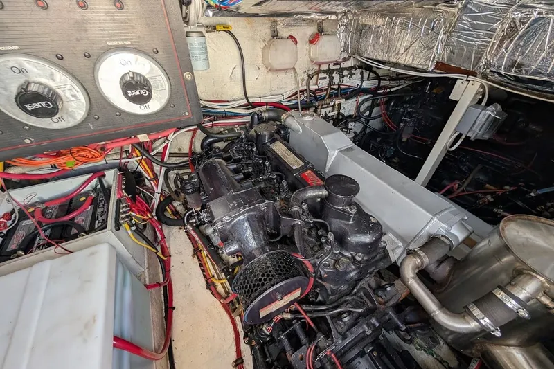 Slide: The Image of Engine room of 1989 Bayliner 3888 Motoryacht with visible wiring and components. - 25