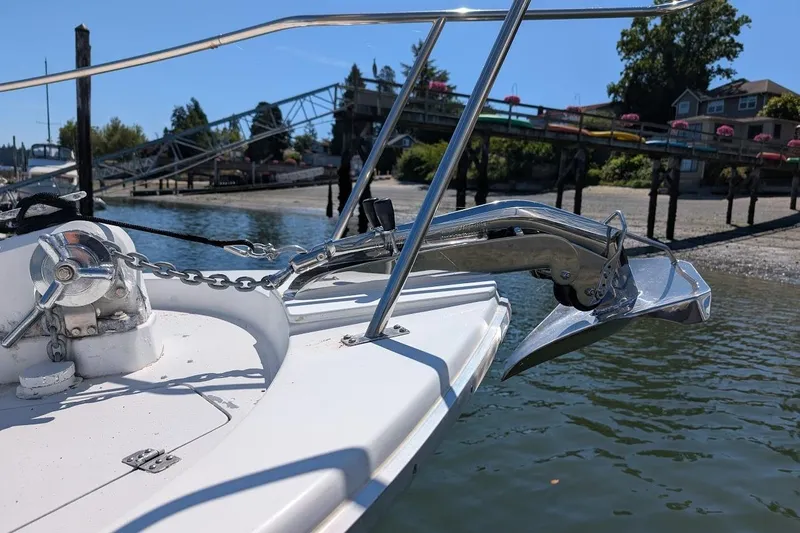 Slide: The Image of 1989 Bayliner 3888 Motoryacht anchor and bow detail near dock. - 7